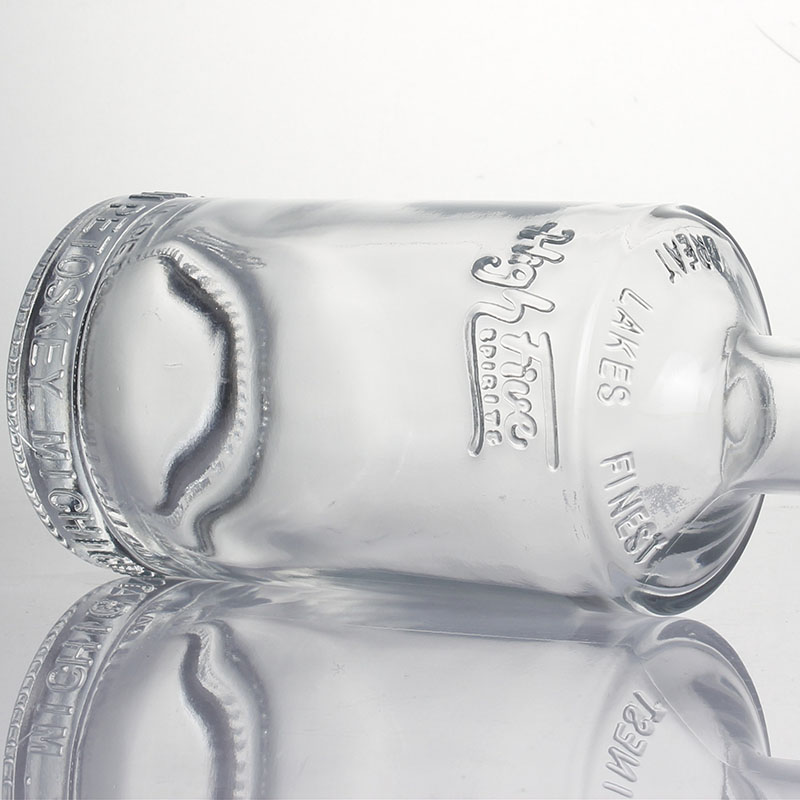 China factory 700ml 750ml embossed super flint vodka rum tequila gin cylinder spirit alcohol glass bottles customized logo