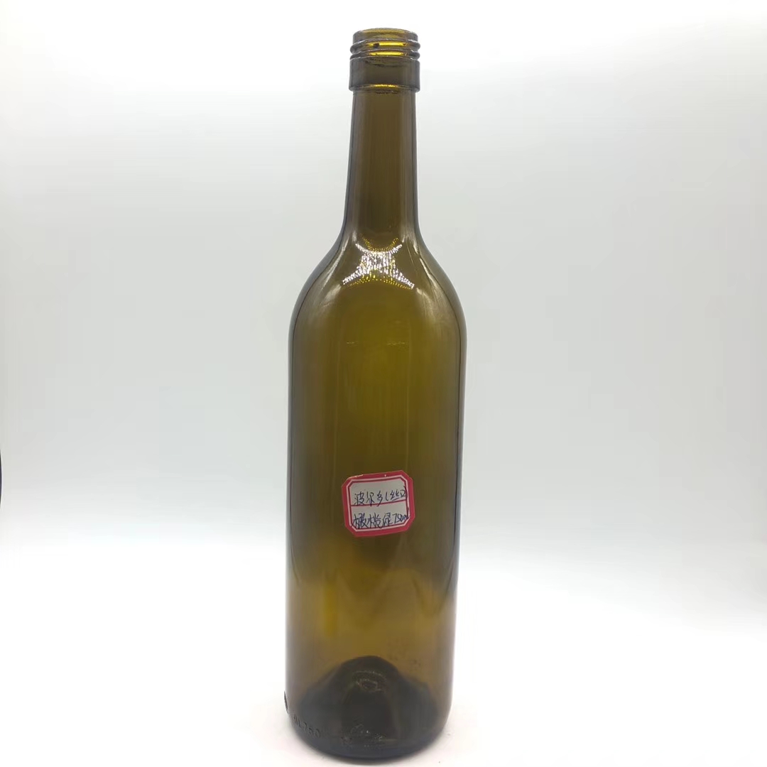 Dark green transparent red wine glass bottle