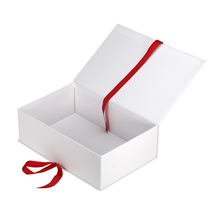 White cardboard paper box magnetic closure with red ribbon