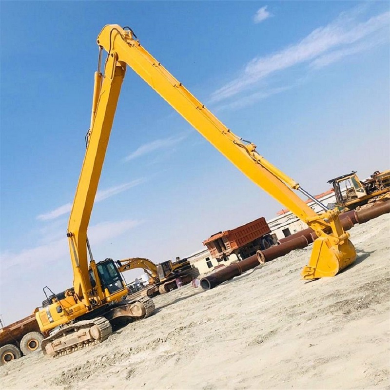 Two-stage long reach boom and arm